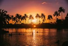 Sun setting over beach in Oahu